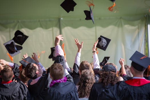 Image of a group of high school graduates celebrating their achievements