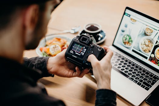 Image of a recent graduate working on a laptop