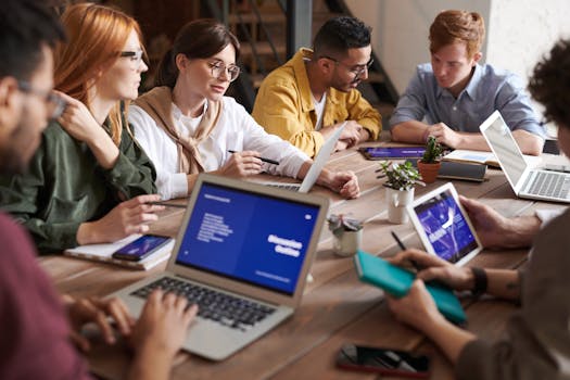 team meeting with laptops