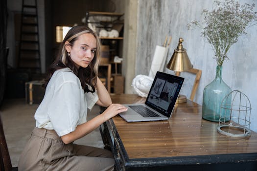 Image of a freelancer working on a laptop with privacy settings visible