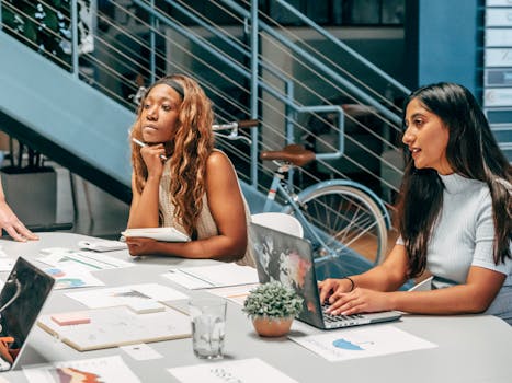 Tech workers collaborating in a modern office space